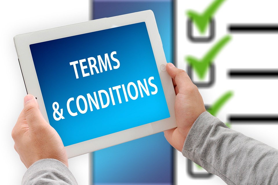 client reading the terms and conditions of their home inspection agreement
