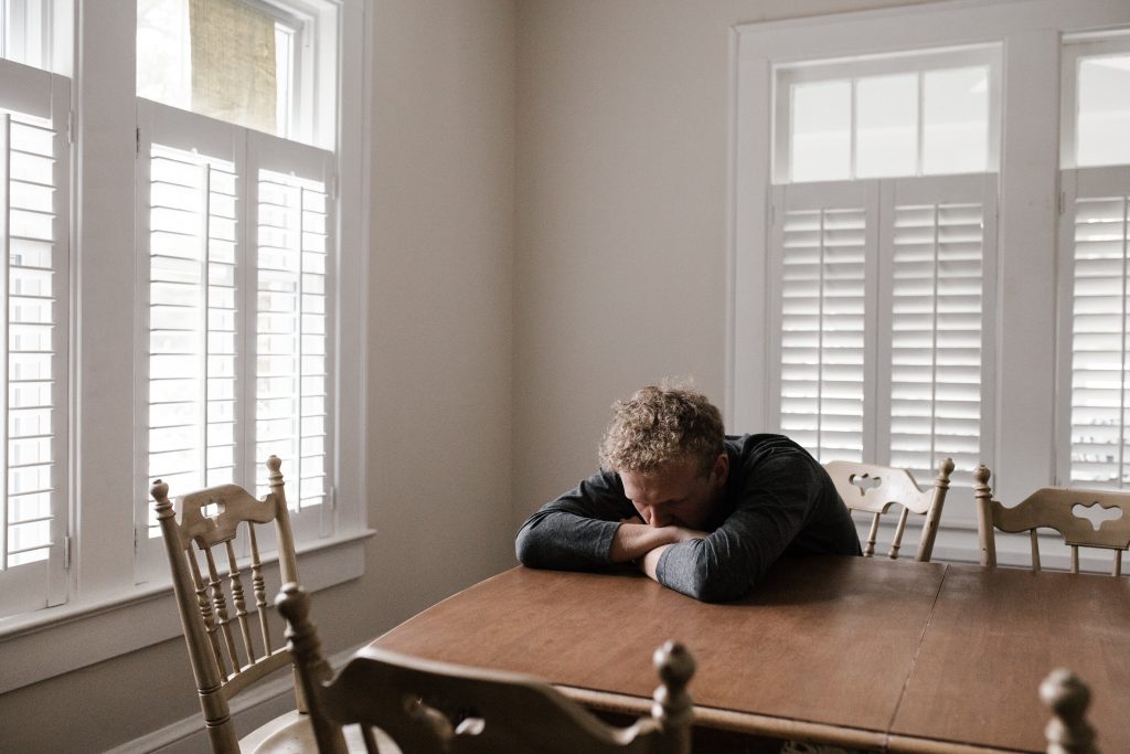 home inspector anxiously waiting for a phone call from a seller