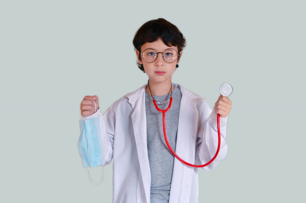 young boy pretending to be a doctor instead of a home inspector