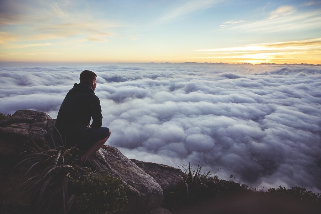 home inspector sitting on a hill thinking about the future of his hoe inspection company