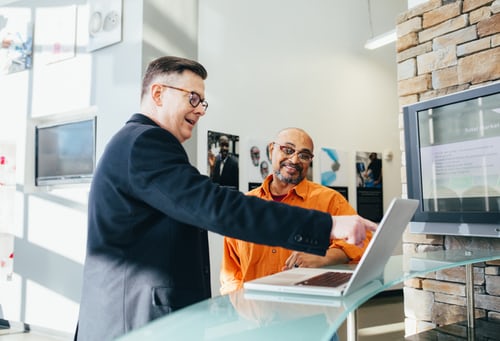 salesperson helping someone pic a home inspector