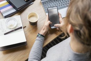 pic of a lady typing on phone